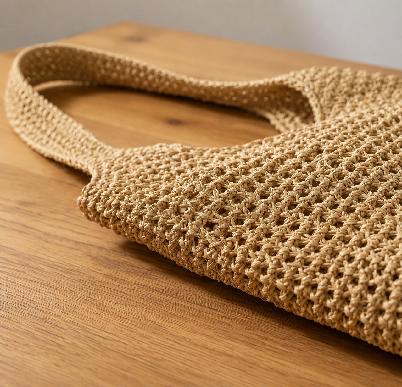 Close-up of the hand-crocheted raffia weave on the Foldable Straw Tote Bag