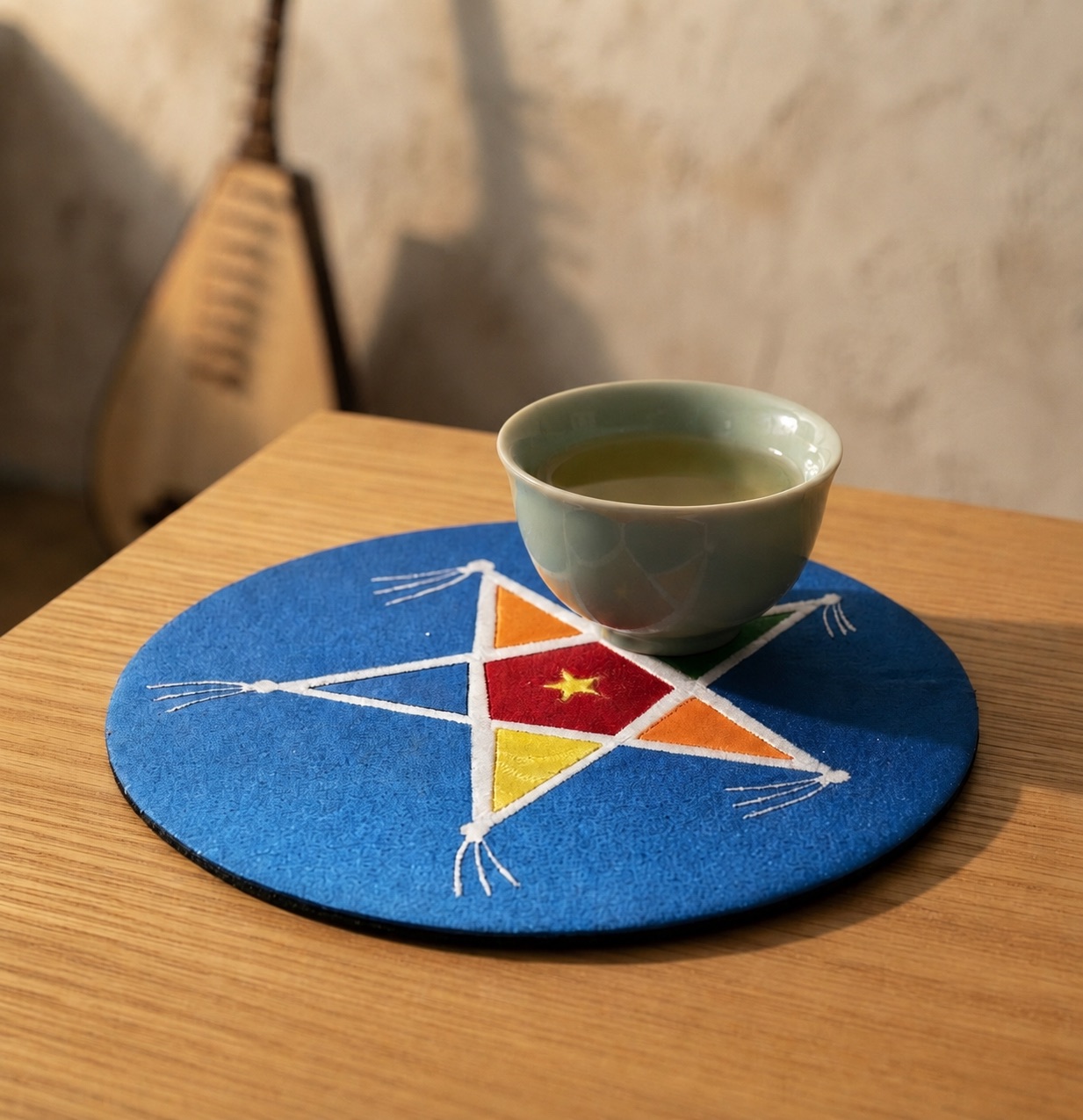 Upcycled Silk Coaster with a hand-pieced star-shaped kite design