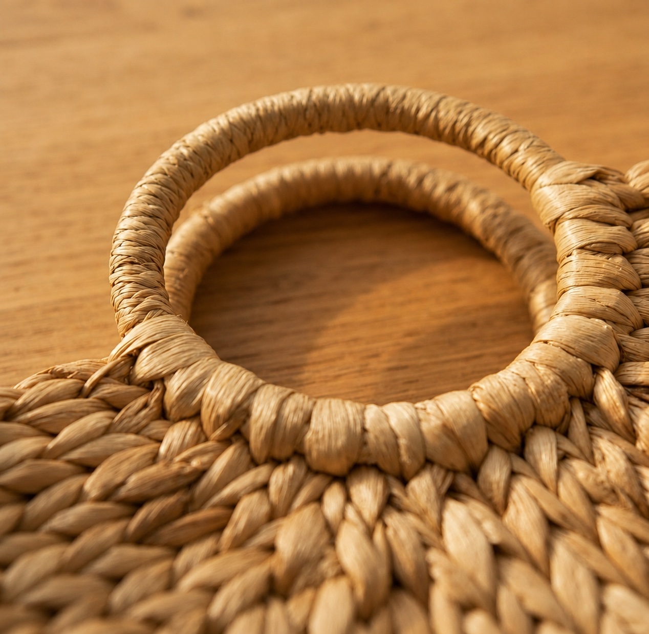 Close-up of the woven water hyacinth handle on the Water Hyacinth Handbag